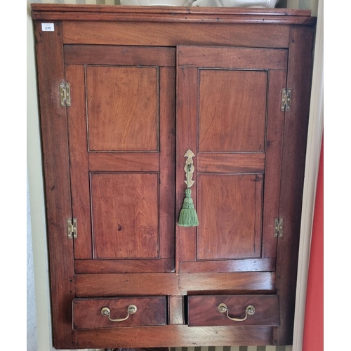 235 - A Georgian Mahogany wall mounted Corner Cabinet with twin doors and twin drawer frieze.
W 83 x H 109... 