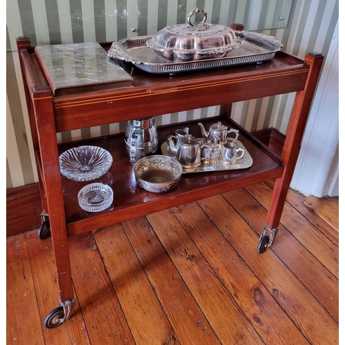 263 - An Edwardian Mahogany two tiered Dumbwaiter/Trolley on metal castors.
81 x 43 x H 79 cm approx.