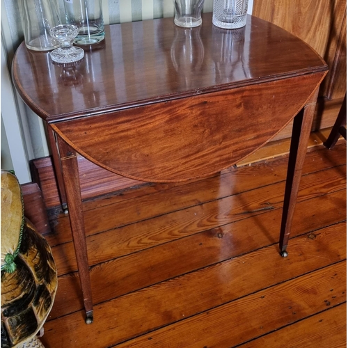 279 - A Regency Mahogany dropleaf Pembroke Table with inlaid outline, square tapered supports and brass ca... 