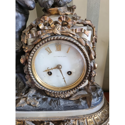 282 - A good 19th Century Bronze and Ormolu French Clock on a marble base depicting a cherub standing besi... 