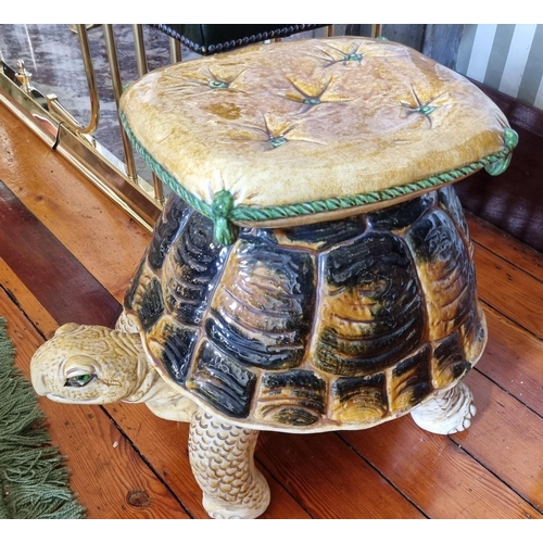 283 - A Plaster Majolica style Seat of a Tortoise under a cushion, in cream and brown ground.
54 x 35 x H ... 