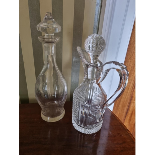 285 - An early Waterford Crystal Decanter of simple form along with another Waterford crystal ewer and oth... 