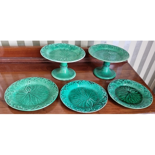 288A - A pair of Wedgewood Green ground Tazzas along with a quantity of similar Plates.