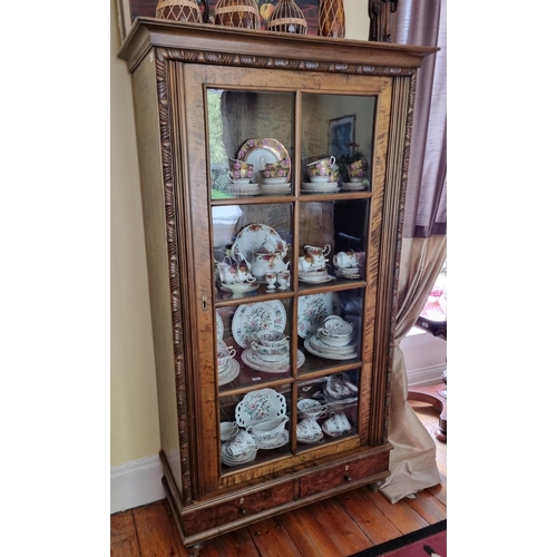 343 - A 20th Century Walnut single door Display Cabinet with glazed panel door and single frieze drawer. 
... 