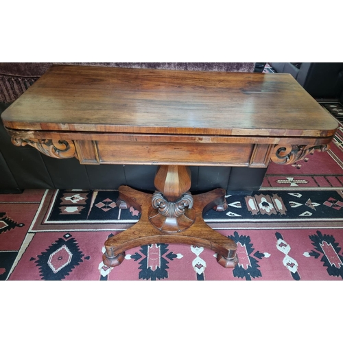 350 - An early 19th Century Rosewood foldover Card Table with carved octagonal support and platform base.
... 