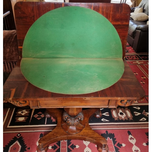 350 - An early 19th Century Rosewood foldover Card Table with carved octagonal support and platform base.
... 