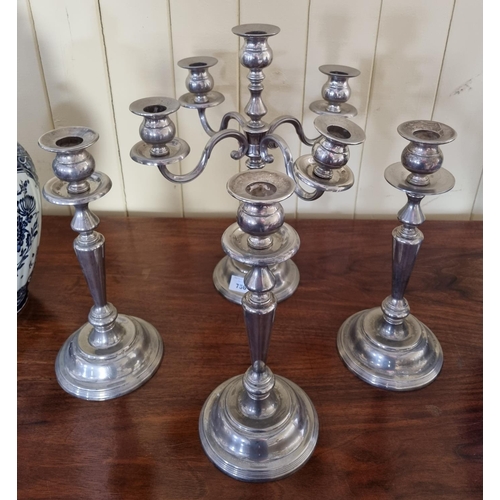 756 - A Silver Plated four branch Candelabra along with a set of three single Candle Sticks. W32 x H36 and... 