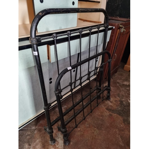 908 - A heavy Cast Iron single Bed with Irons. W 89 cm approx.