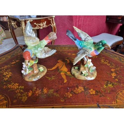 236 - A pair of Staffordshire bone china Bird Figures designed and modelled by J T Jones. H 16 cm approx.