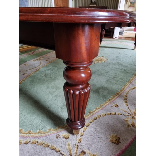 252 - A magnificent 19th Century Dining Table on substantial turned and reeded supports and moulded edge w... 