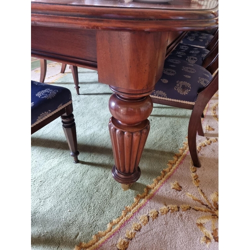 252 - A magnificent 19th Century Dining Table on substantial turned and reeded supports and moulded edge w... 