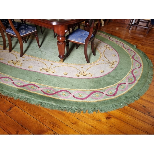 292 - A Fantastic oval green ground Donegal Carpet with multi borders and swagged interior.
570 x 338 cm a... 