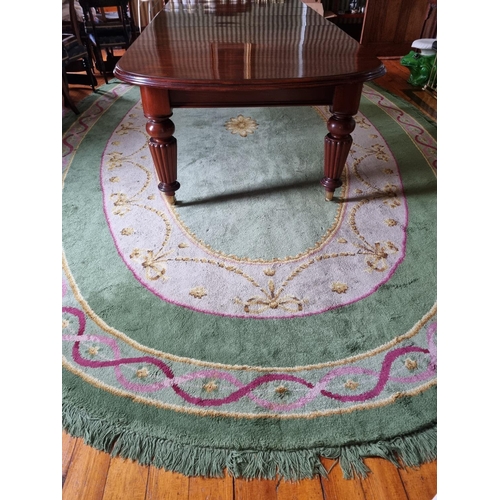 292 - A Fantastic oval green ground Donegal Carpet with multi borders and swagged interior.
570 x 338 cm a... 