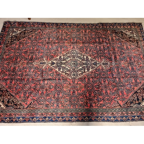 74 - A Wool pile Persian Kashan Carpet with Terracotta and rich Blue ground from the Shahrukh region. 300... 