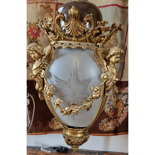 760 - A really good Brass hall Lantern profusely embossed with Cherubs with a cloudy glass shade. W 40 x H... 