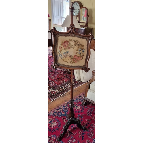 760A - A 19th Century Rosewood pole Screen with tapestry panel on tripod support. W37 x H142cm approx.