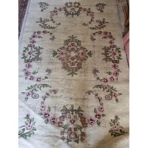 817 - A Persian Runner with some faults along with two cream ground Rugs. 280 x 66 and 240 x 152cm approx.