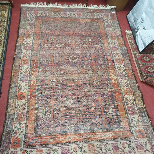 281 - A Persian red and cream ground Rug. 124 x 190 cm approx.