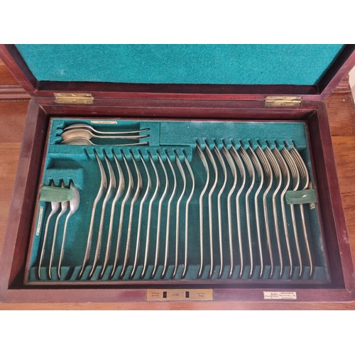 290A - An early 20th century mahogany cased canteen of plated cutlery. Baize lined interior with sectional ... 