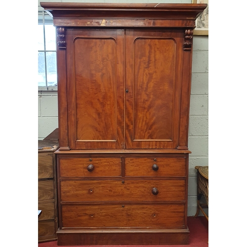 144 - A 19th Century Mahogany Gentleman's Linen Press with twin door top over two short and two long drawe... 