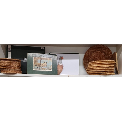 177 - A good quantity of table Mats along with a cased cheese Board and other items.