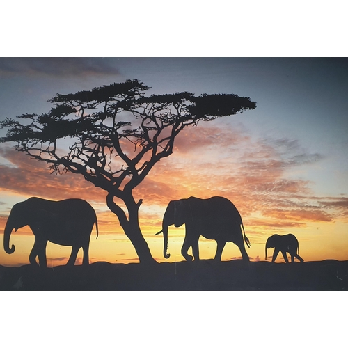 208 - A very large Oleograph on Canvas of elephants at dusk. 80 x 120 cm approx.