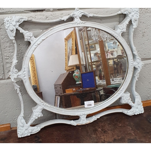 256 - An early 19th Century Painted Plaster Gilt oval Mirror. 48 x 40 cm approx.