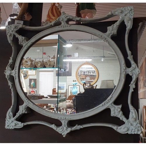 256 - An early 19th Century Painted Plaster Gilt oval Mirror. 48 x 40 cm approx.