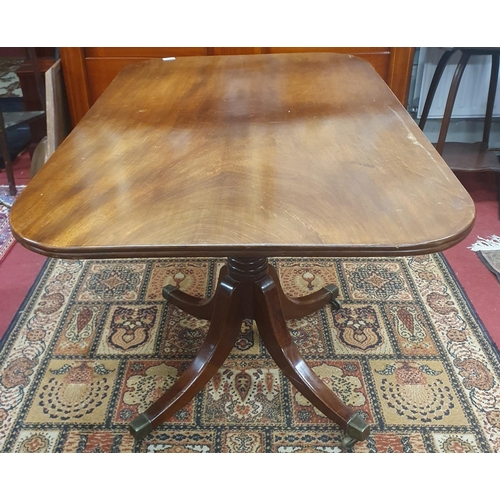 275 - A 19th Century Mahogany rectangular Supper Table on quatrefoil base and brass castors. 69 x 107 x H ... 