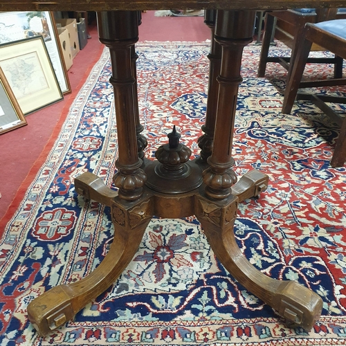 415 - A 19th Century Walnut and Veneered Foldover Card Table on quatrefoil carved base. 94 x 98 x H 71 cm ... 