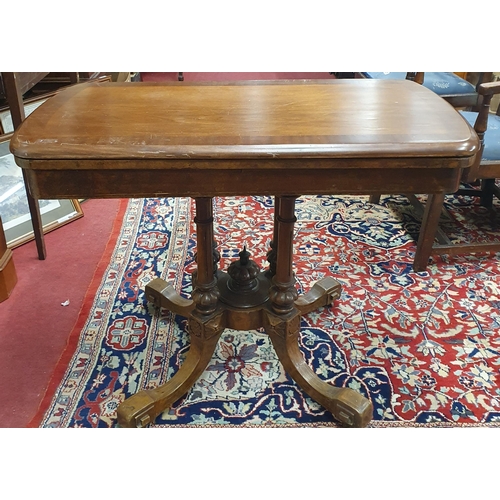 415 - A 19th Century Walnut and Veneered Foldover Card Table on quatrefoil carved base. 94 x 98 x H 71 cm ... 