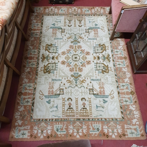 433 - A brown and cream ground Rug decorated with ships and birds. 200 x 140 cm approx.