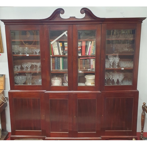 463 - A Fantastic 19th Century Mahogany four door breakfront Bookcase, with panelled lower section and gla... 