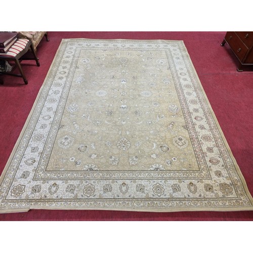 603 - A large Belgium cream ground Carpet with all over decoration and multi borders. 330 x 240 cms approx... 