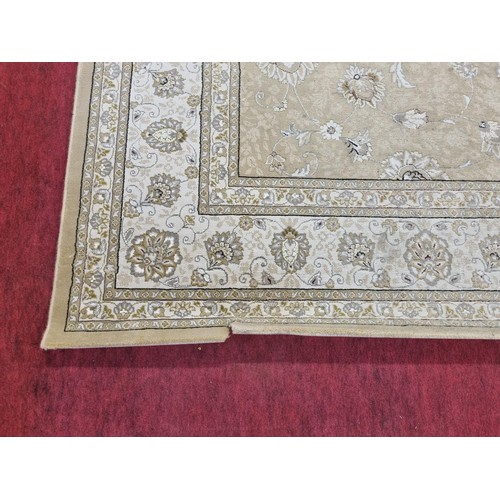 603 - A large Belgium cream ground Carpet with all over decoration and multi borders. 330 x 240 cms approx... 