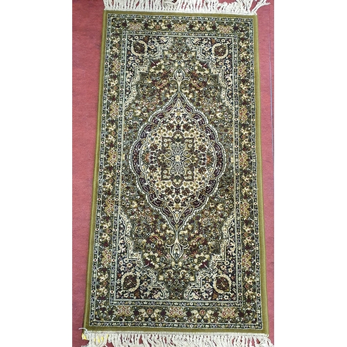 613 - A green ground Rug with multi borders and allover decoration. 150 x 69 cm approx.