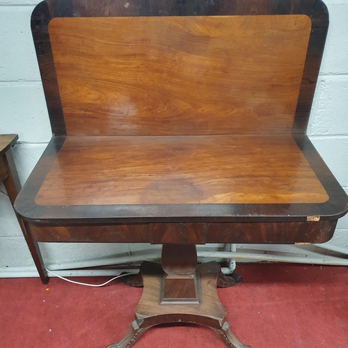 790 - A Regency Mahogany fold over Tea Table on square centre shaft and platform base. 91 x 90 x H 71 cm a... 