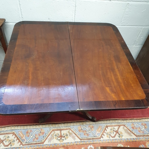 790 - A Regency Mahogany fold over Tea Table on square centre shaft and platform base. 91 x 90 x H 71 cm a... 