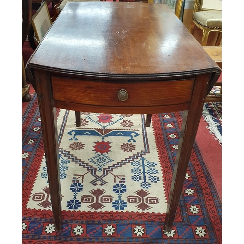 927 - A 19th Century Mahogany oval Dropleaf Table with frieze drawer raised on square tapered supports. 10... 