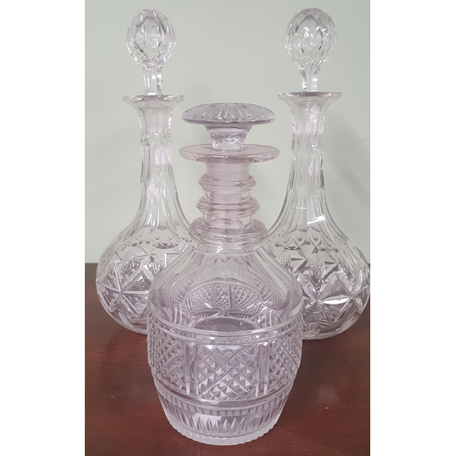 983 - A good pair of Victorian cut Glass Wine Decanters each with a bulbous stopper 33cm approx. along wit... 