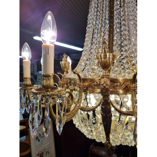 1034 - A Magnificent Crystal and Brass twelve branch Chandelier with basket base. H 124 x D 90 cm approx.