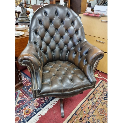 1041 - A good deep buttoned swivel office Chair.