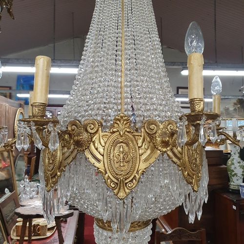 1057 - A Magnificent Crystal and Brass twelve branch Chandelier with basket base. Drop 125 x D 70 cm approx... 