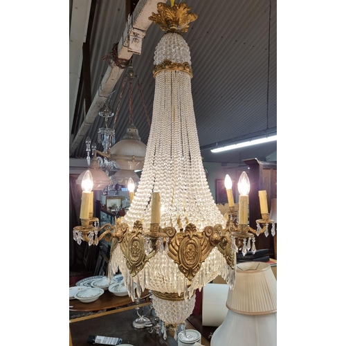 1057 - A Magnificent Crystal and Brass twelve branch Chandelier with basket base. Drop 125 x D 70 cm approx... 