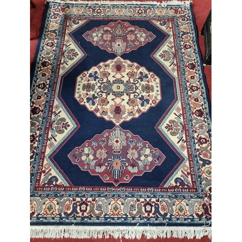 1076 - A blue and cream ground Carpet with muti borders and allover decoration. L 240 x W 170 cm approx.