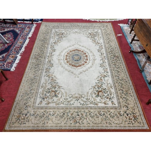 1077 - A lovely cream ground Carpet with with a floral central and trailing flowers.  280cm x 200cm approx.