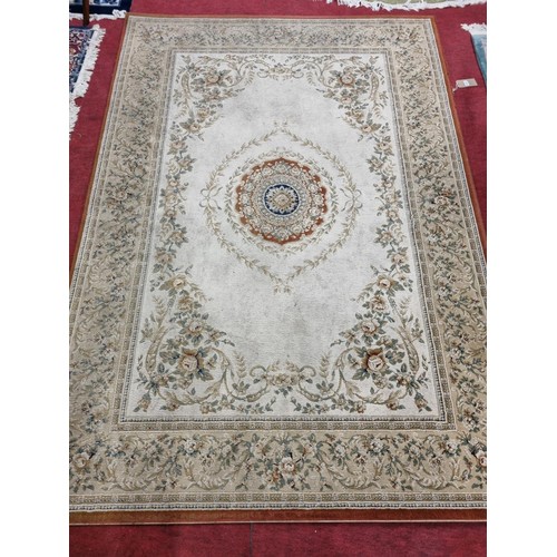 1077 - A lovely cream ground Carpet with with a floral central and trailing flowers.  280cm x 200cm approx.