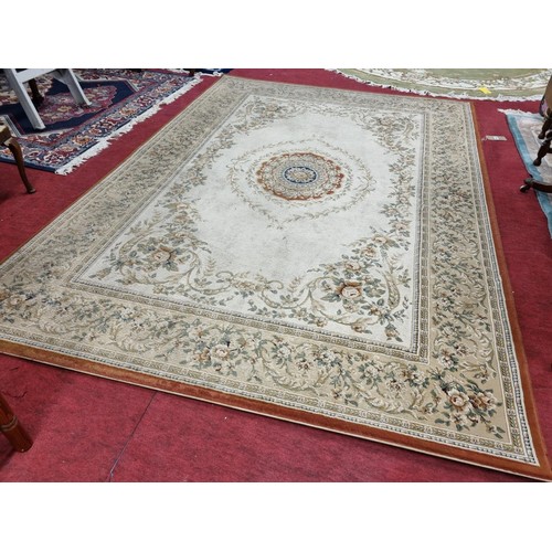 1077 - A lovely cream ground Carpet with with a floral central and trailing flowers.  280cm x 200cm approx.