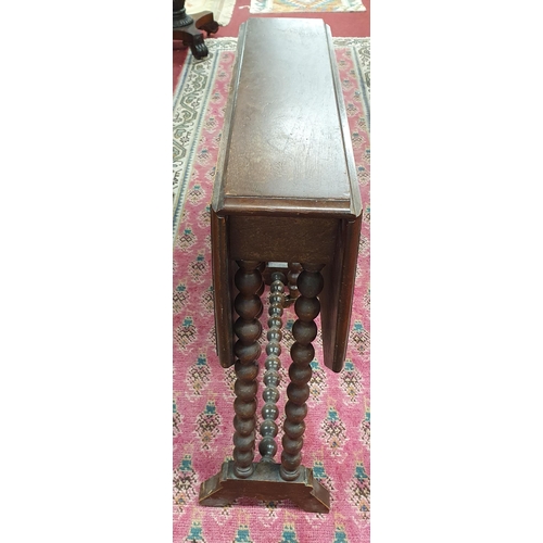 1112 - A 19th Century Walnut Sutherland Table on turned bobbin supports. 64 x 77 x H 62 cm approx.