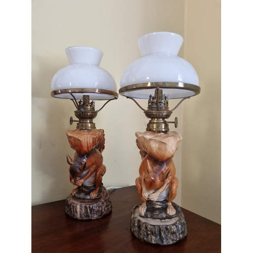 365 - A really good pair of Porcelain Table Lamps depicting squirrels eating nuts.   H 28 cm approx.